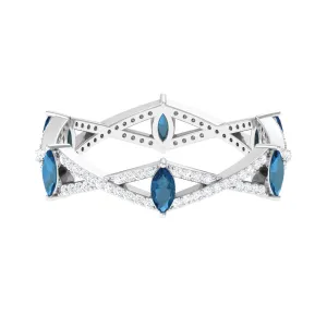 London Blue Topaz and Diamond Crossover Eternity Ring